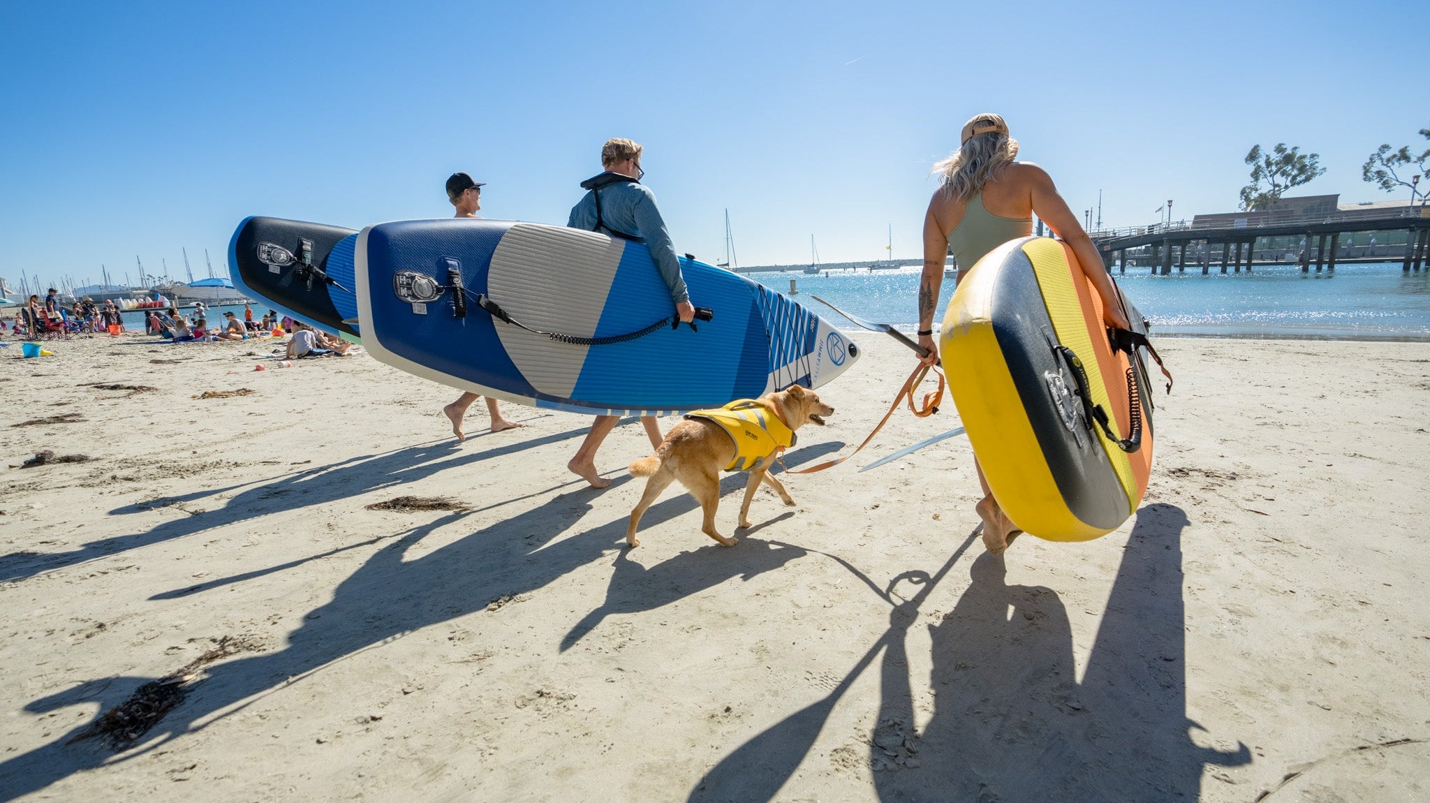A group of people is about to paddleboarding with Jimmy Styks ISUPs2