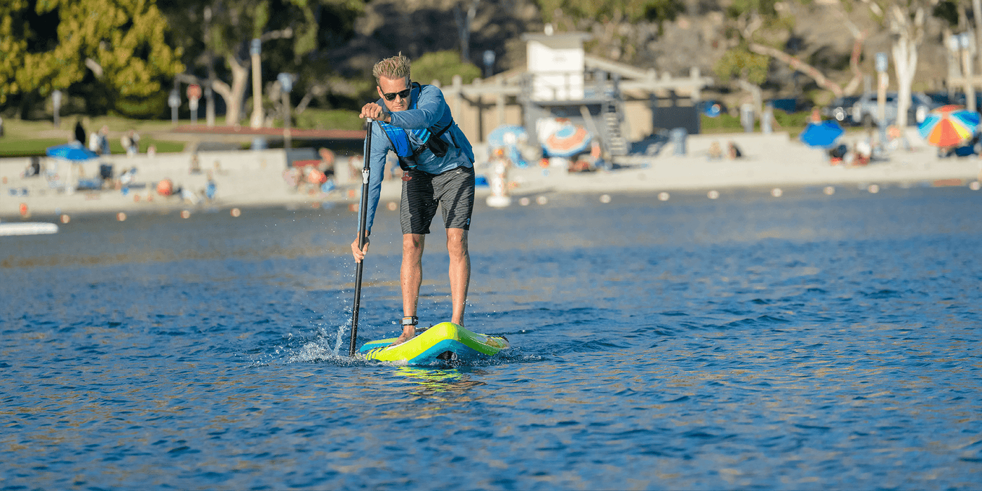 A man is paddling on the Jimmy Styks Channel Inflatable SUP