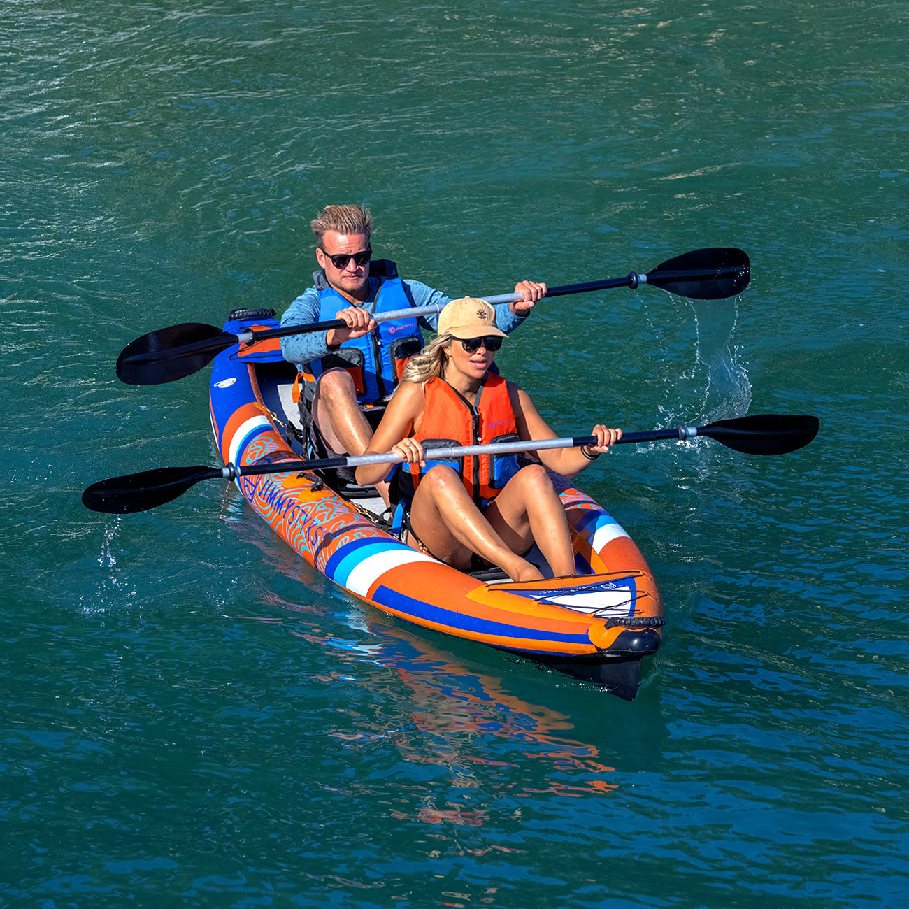 a man and a woman is paddling with inflatable kayak