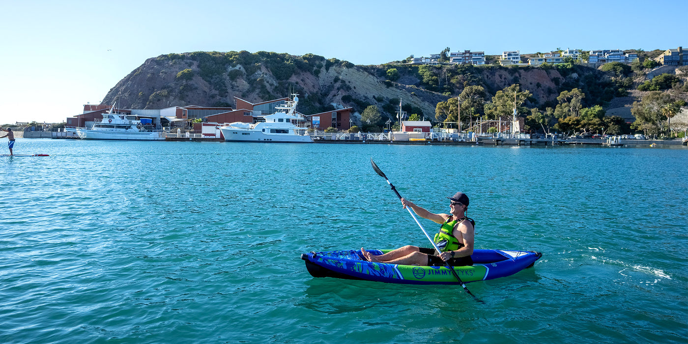 A man is kayaking with Jimmy Styks Inflatable Kayak
