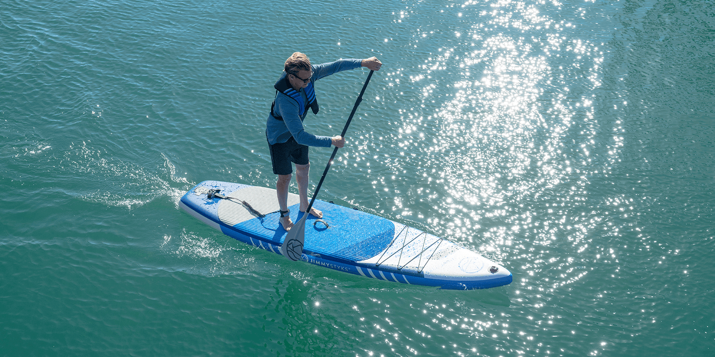 A man is paddling with Jimmy Styks Strider